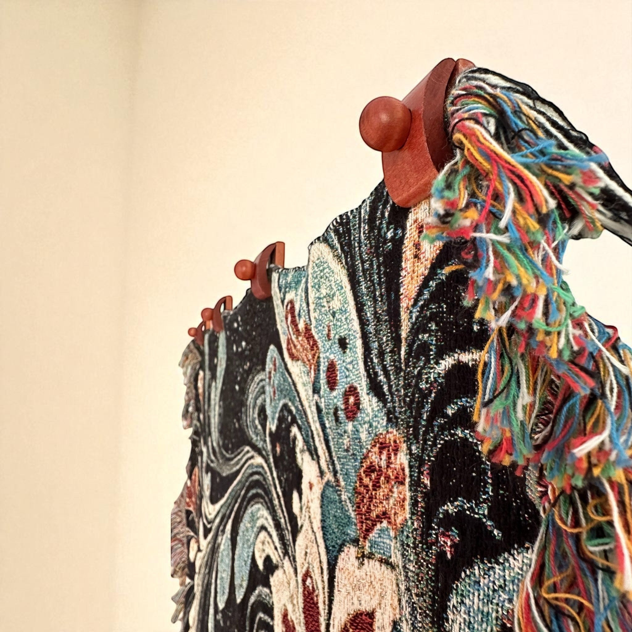Kök Stüdyo Gothic Floral woven throw blanket in cotton, featuring a traditional Turkish marbling design with vibrant multicolor tassels.