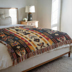 Kök Stüdyo Seminoles woven throw blanket with Native American geometric patterns in cream, black, red, gold, and turquoise. Pure cotton jacquard.
