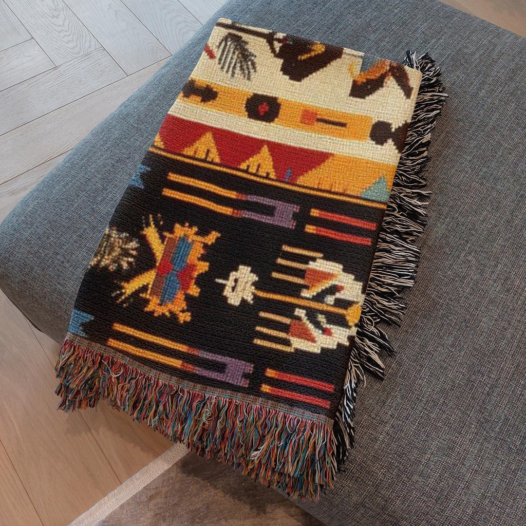 Kök Stüdyo Seminoles woven throw blanket with Native American geometric patterns in cream, black, red, gold, and turquoise. Pure cotton jacquard with fringe.