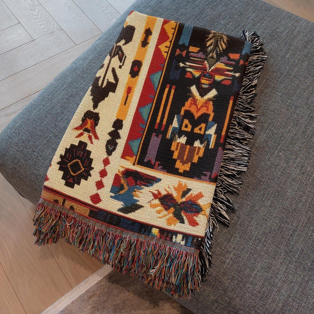 Kök Stüdyo Seminoles woven throw blanket with Native American geometric patterns in cream, black, red, gold, and turquoise. Pure cotton jacquard with fringe.