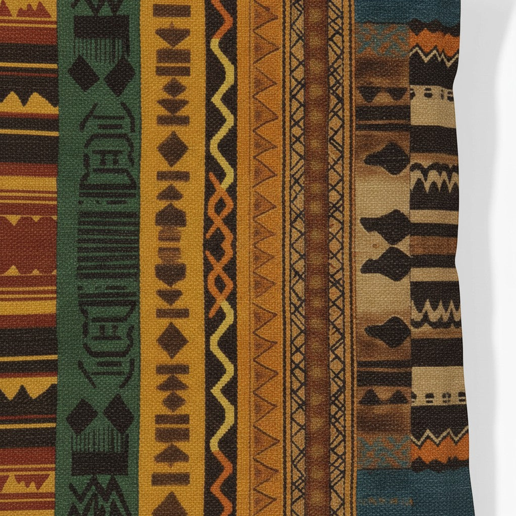 Kök Stüdyo African Ndelebe pattern woven throw pillow with geometric designs in rust, green, yellow, and brown tapestry fabric.