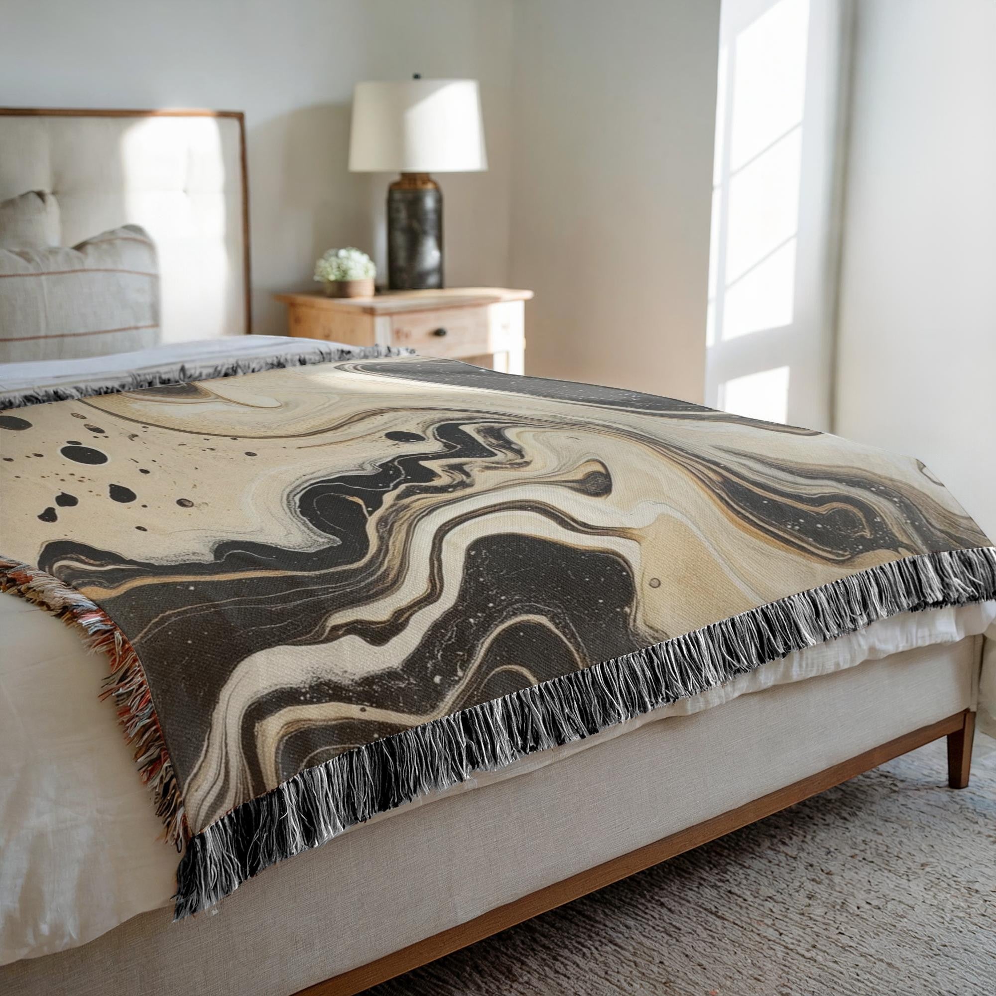 Kök Stüdyo abstract black and white Ebru marbling woven throw blanket, soft cotton tapestry with fringed edges.
