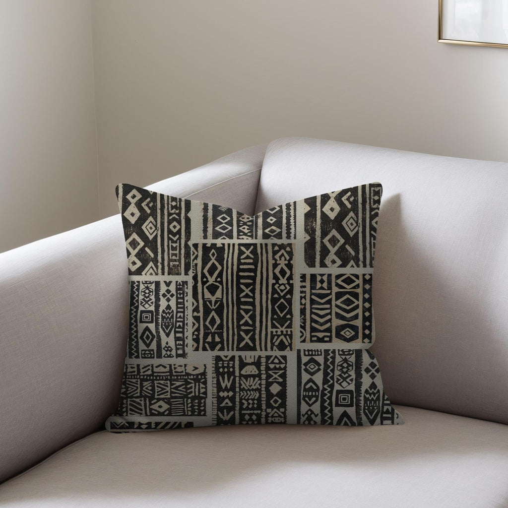 Kök Stüdyo African mud cloth inspired woven throw pillow with tufted geometric pattern in black and beige.