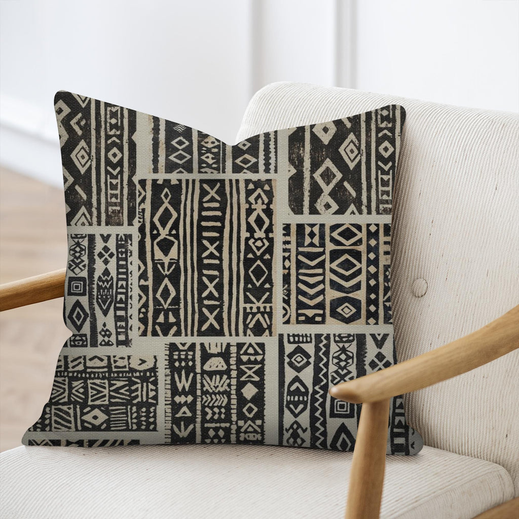 Kök Stüdyo African Mud Cloth inspired woven pillow with geometric patterns and tufted texture, 17x18 inches.