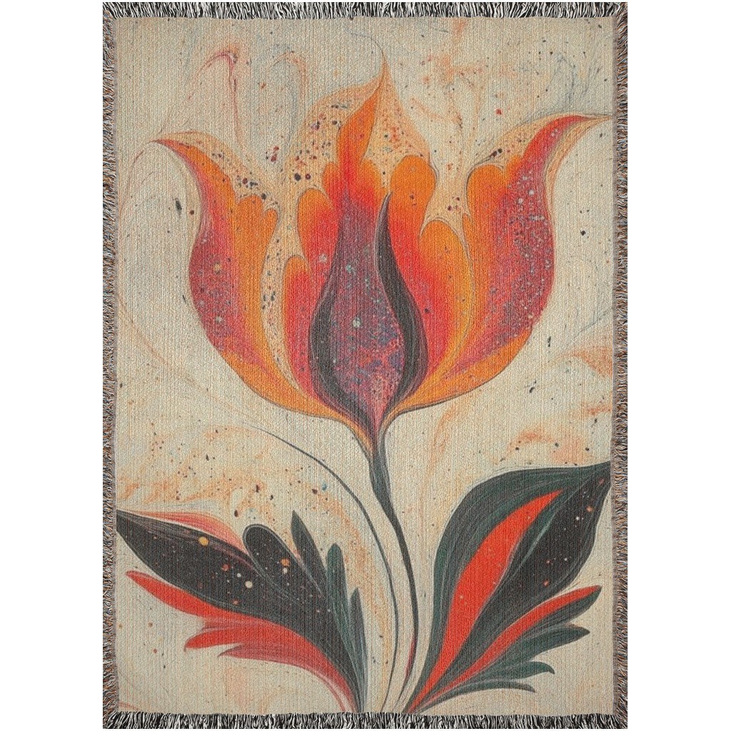 Kök Stüdyo woven throw blanket with a vibrant orange and red tulip design inspired by Turkish marbling art, made of 100% cotton.