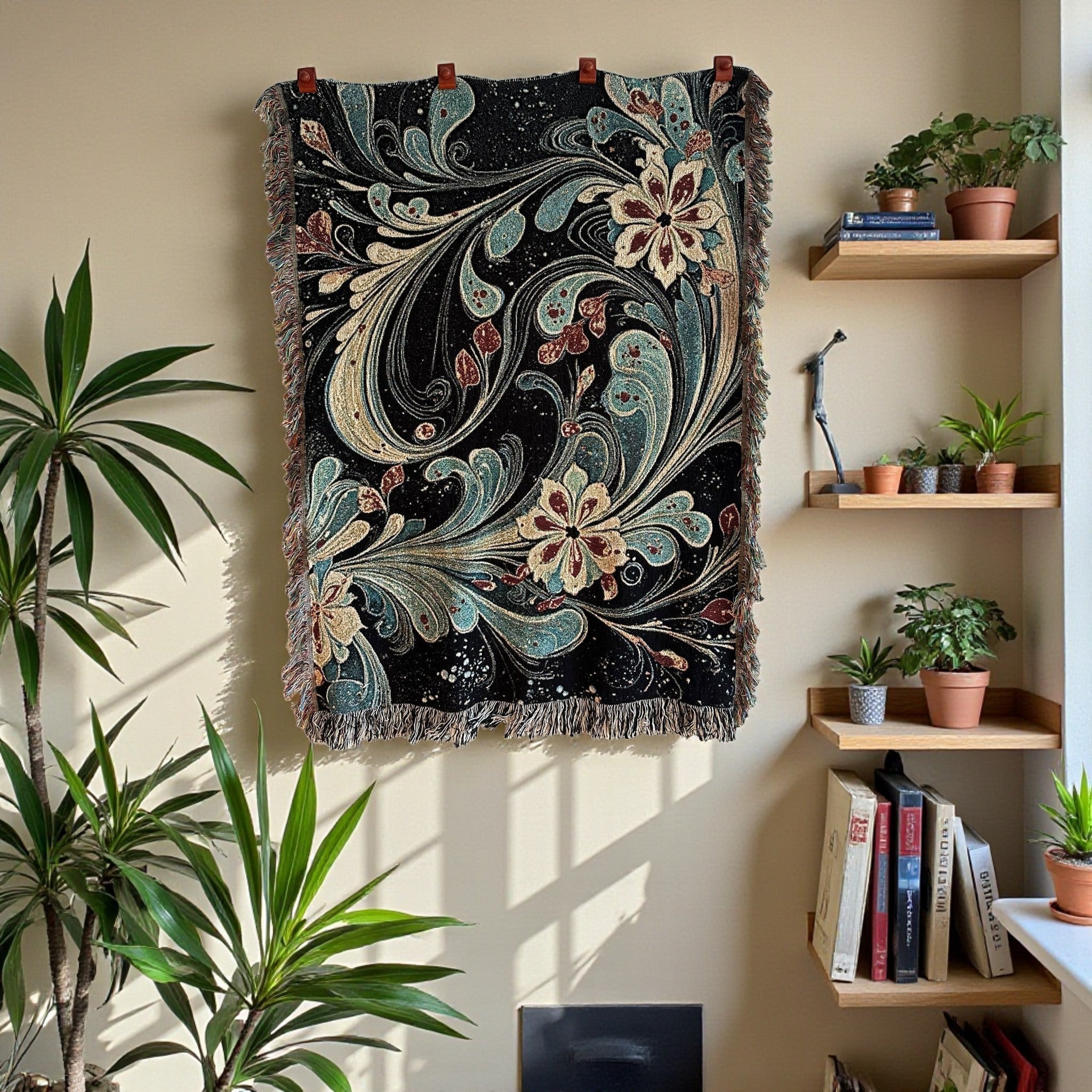 Kök Stüdyo black cotton throw blanket with a traditional Turkish marbling floral design in teal, gold, and burgundy. Fringed edges.