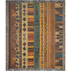 Kök Stüdyo woven throw blanket with Ndebele-inspired geometric patterns in earthy tones and vibrant accents. Cotton blend.